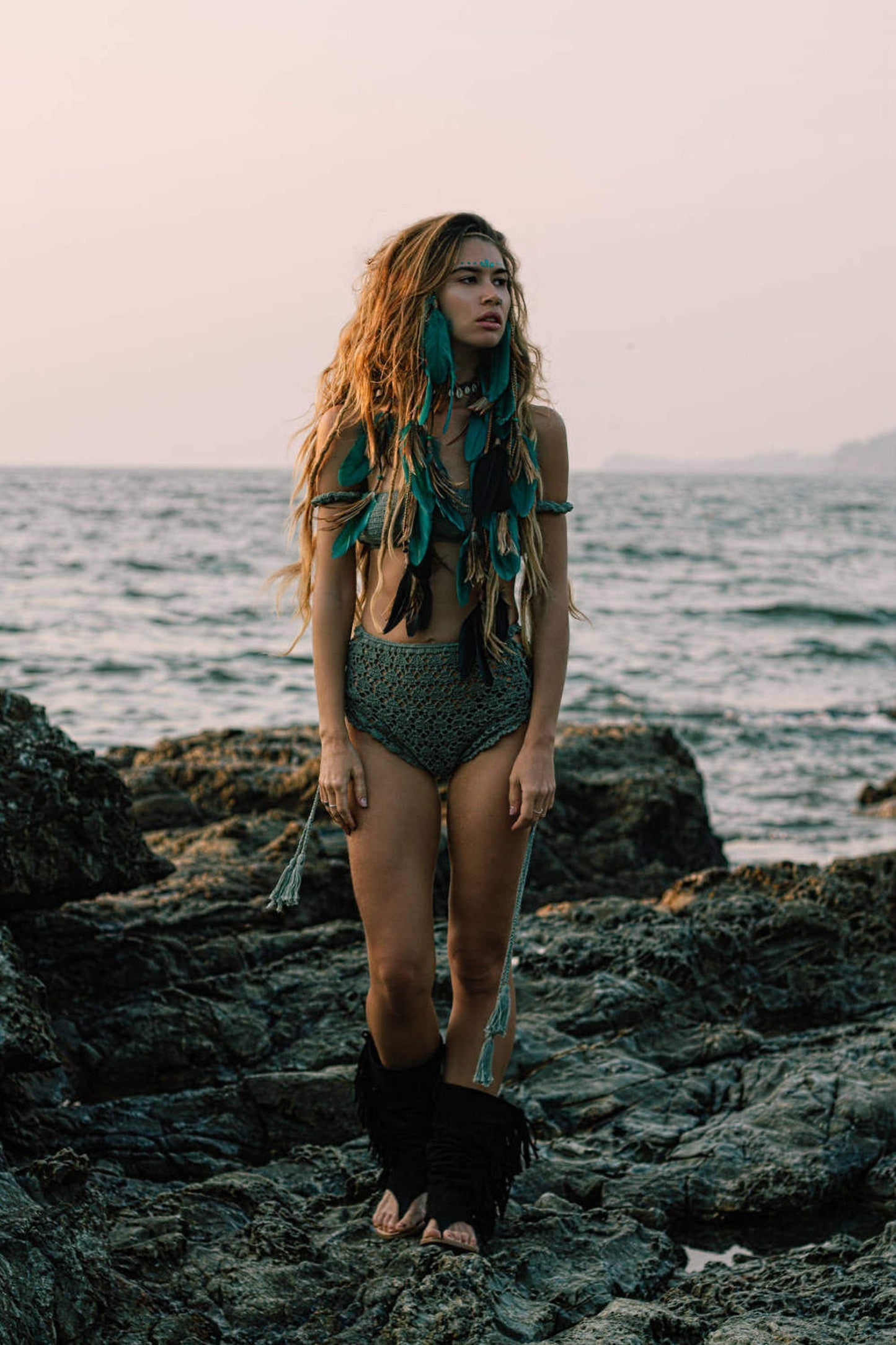 Turquoise headpiece with feathers and braids