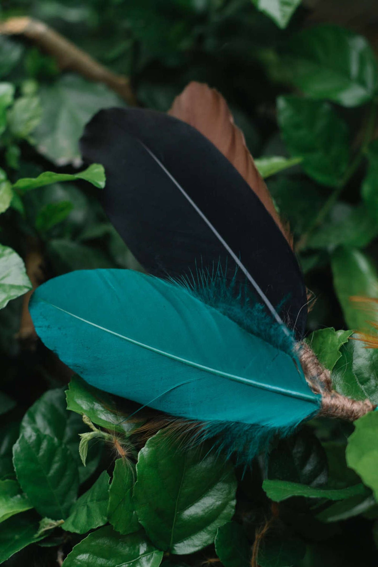 Turquoise headpiece with feathers and braids