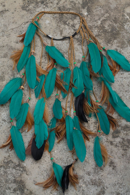Turquoise headpiece with feathers and braids