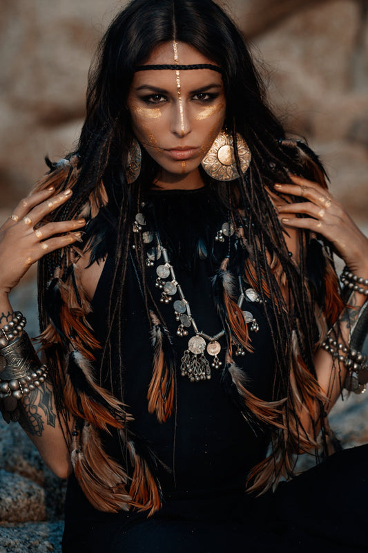 Black headpiece with feathers and added dreadlocks