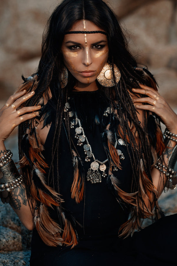 Black headpiece with feathers and added dreadlocks