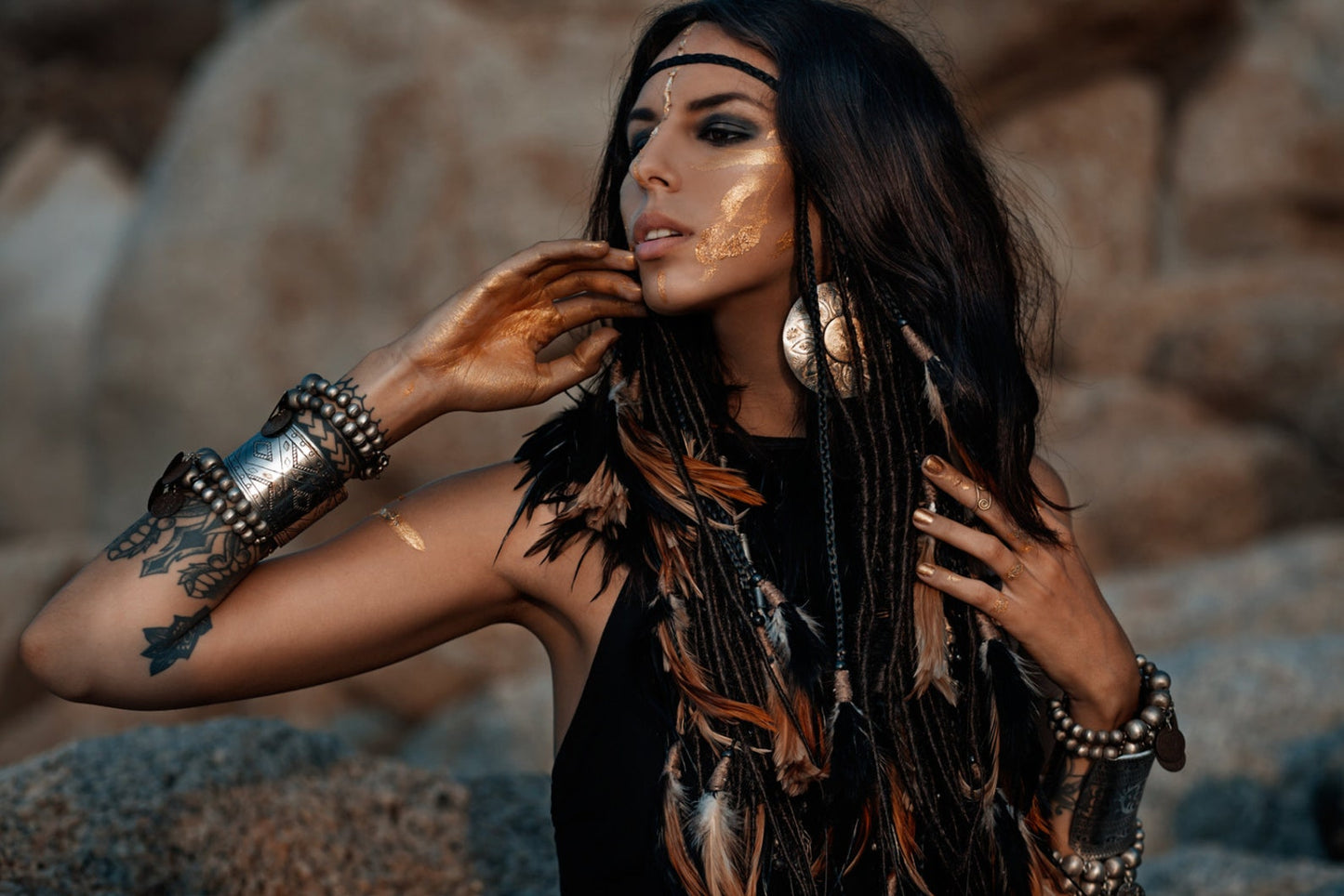 Black headpiece with feathers and added dreadlocks