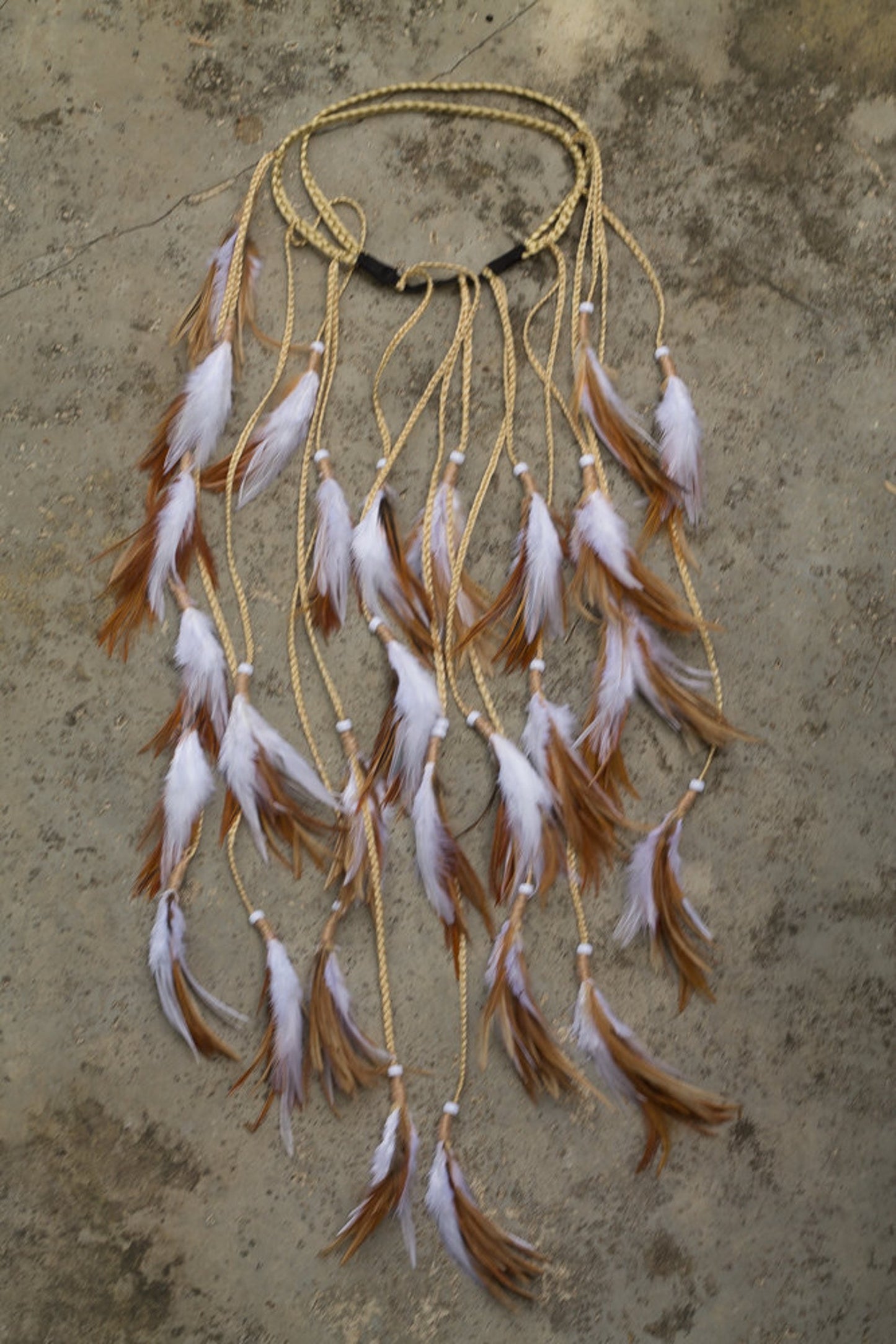 White headpiece with soft feathers